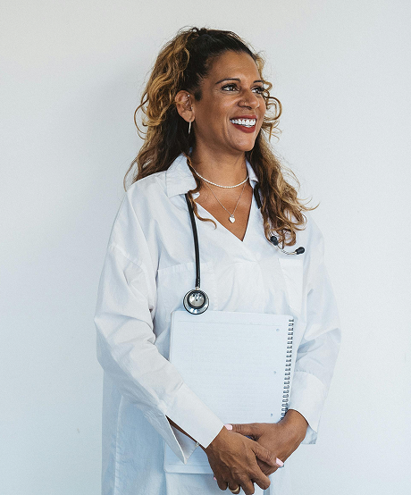 Nurse practitioner standing and smiling