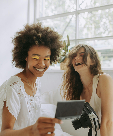 Two friends laughing together