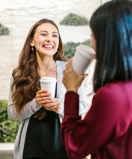 Two women talking over coffee